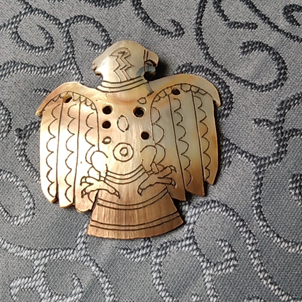 Handmade pin from a shell